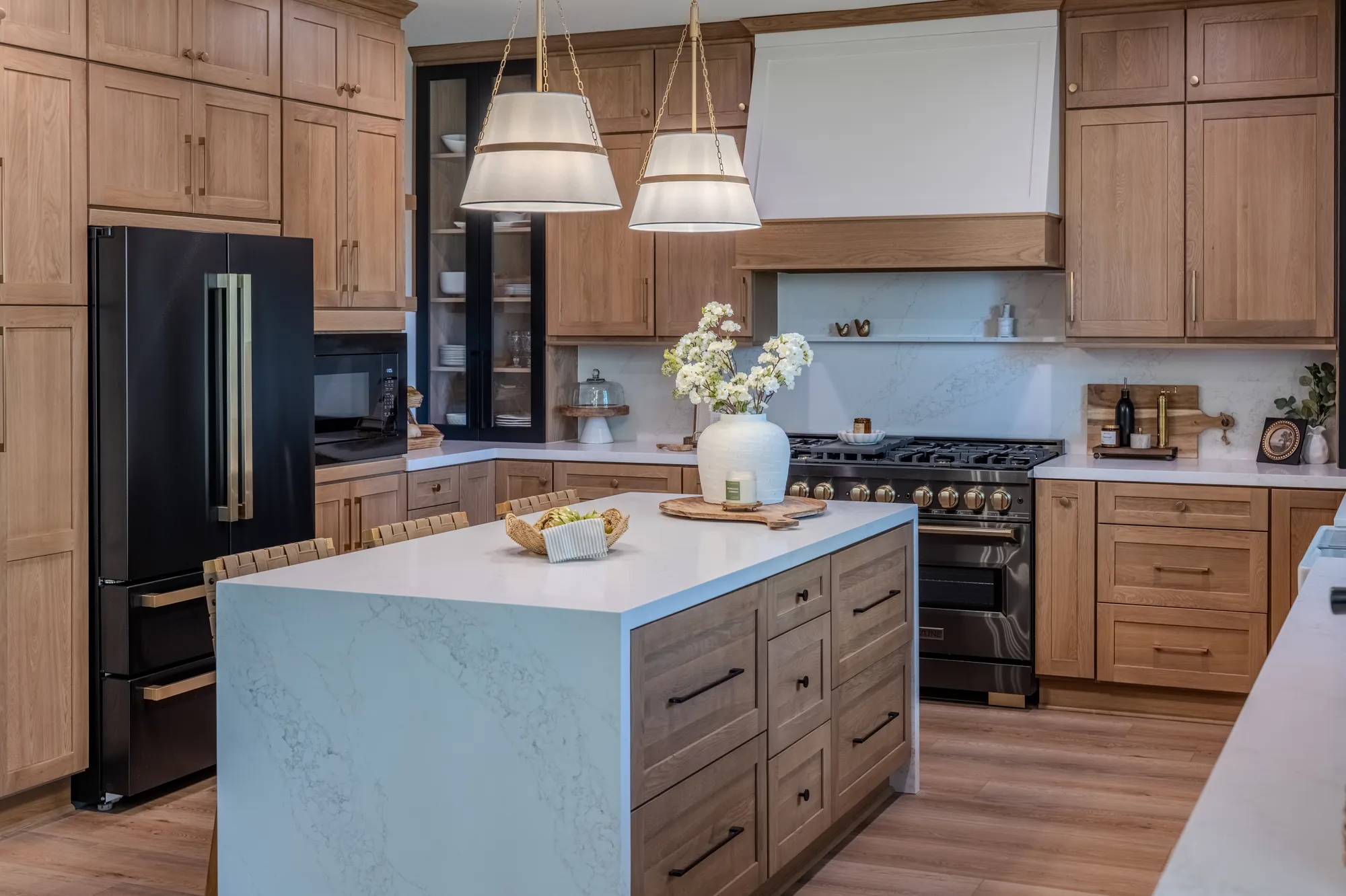 Pacific Stone kitchen remodel with warm cabinetry and a bright central island