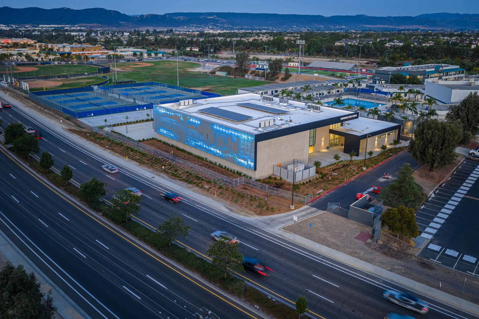 Chaparral High School auxiliary gym at dusk photographed for Neff Construction