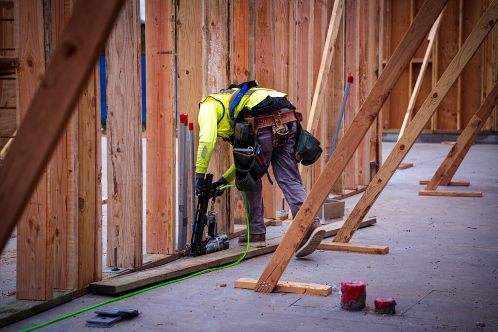 Worker framing French Valley Childcare during construction